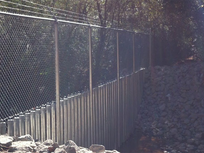 Commercial security fence over a river in Marietta, GA